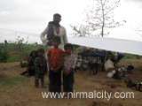 Rajasthani migrants in Narsapur village near temple